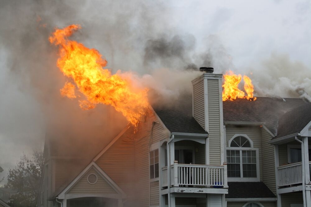 Burning house with flames bursting